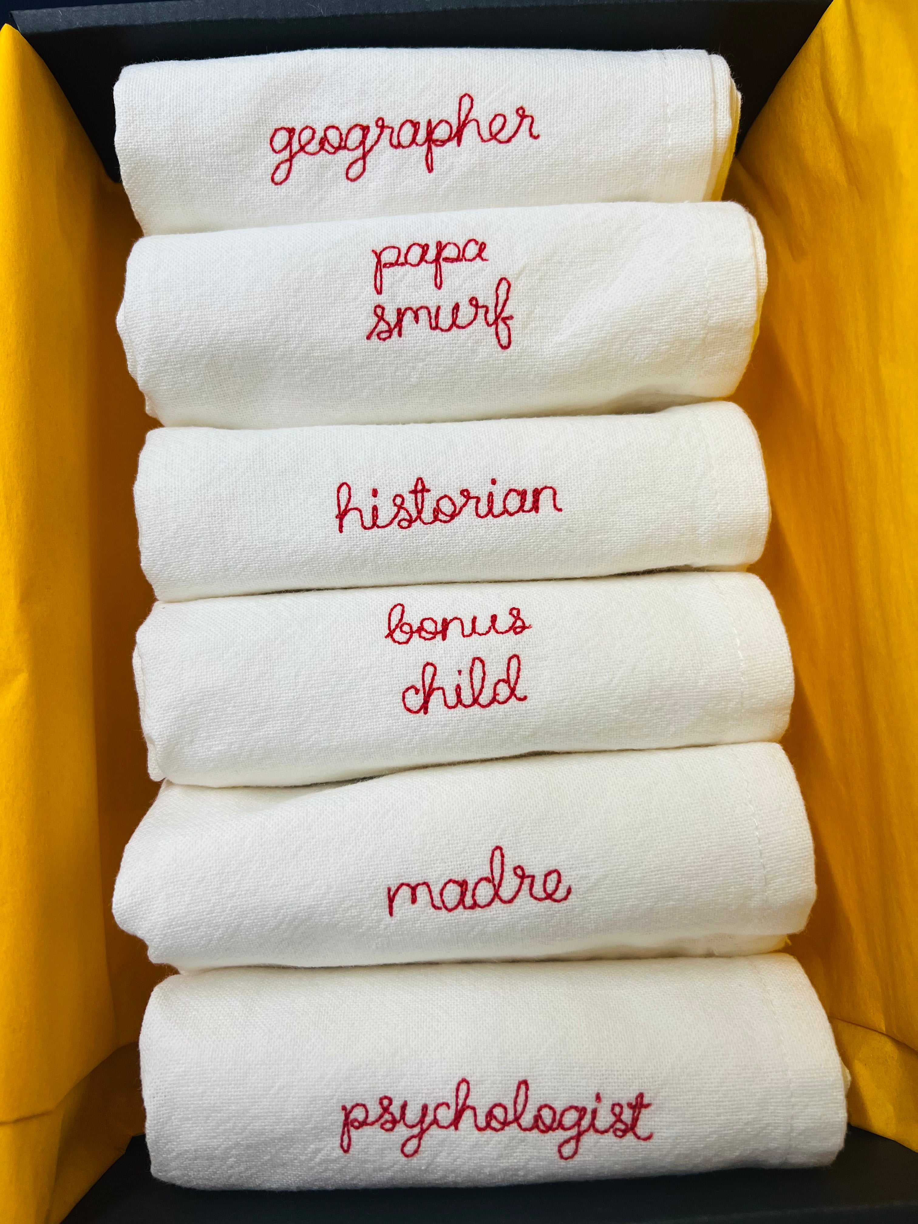 Set of six personalised nickname napkins for the whole family tablescape with phrases like madre, bonus child, papa