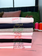 Pile of personalised embroidered t-shirts