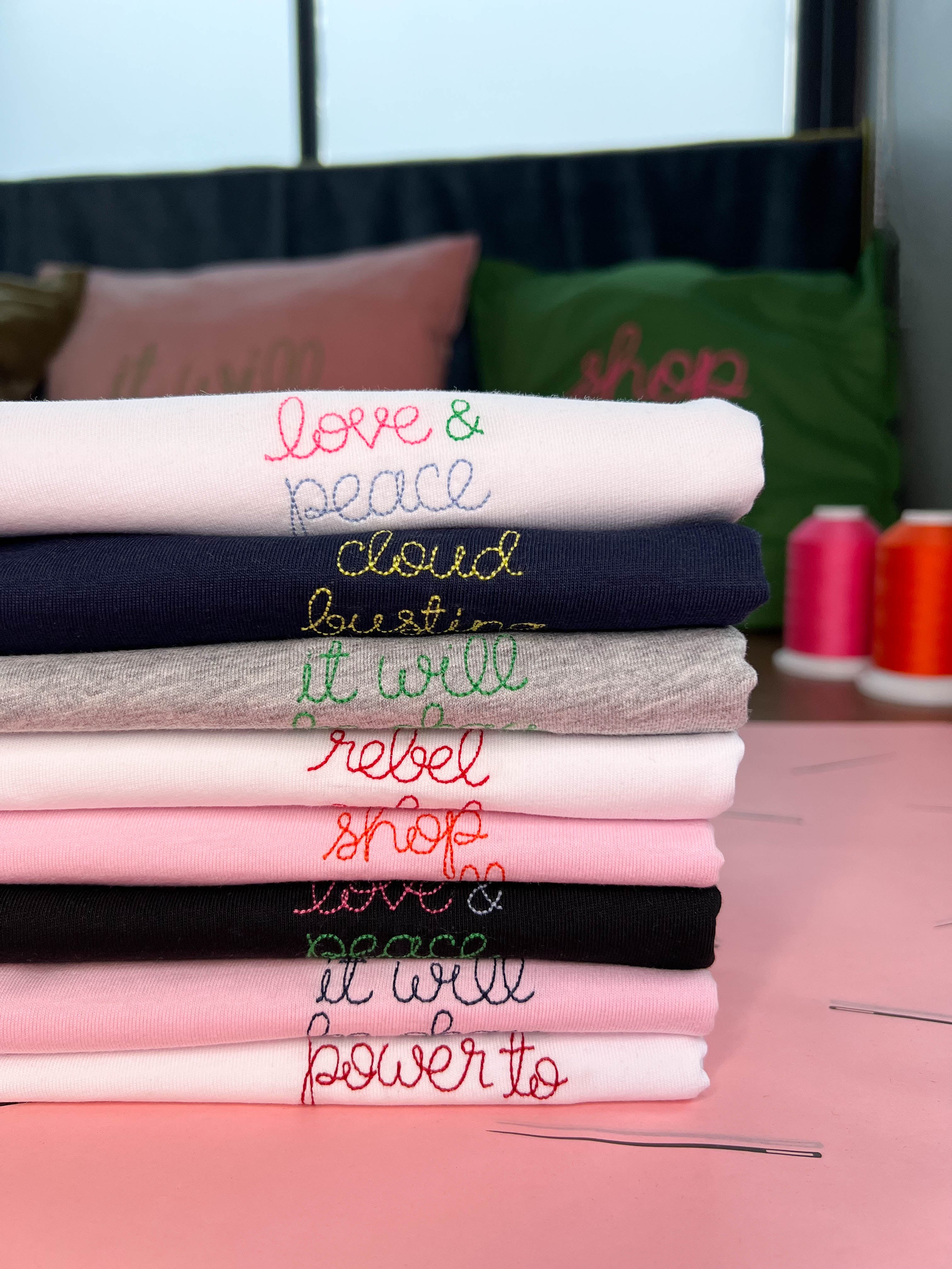 Pile of personalised embroidered t-shirts