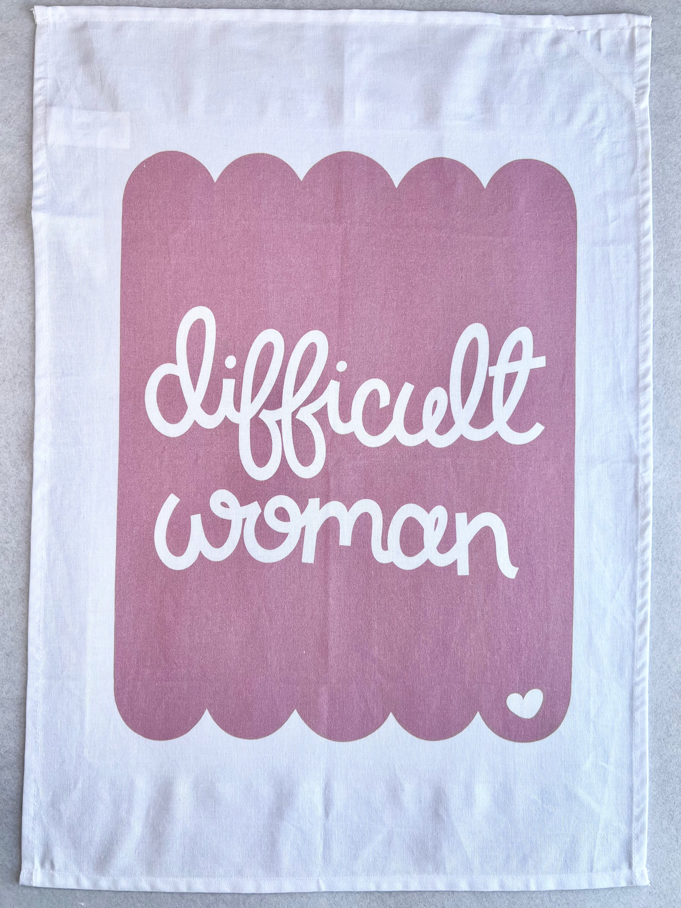 Cotton tea towel with pink scallop design and the words difficult woman