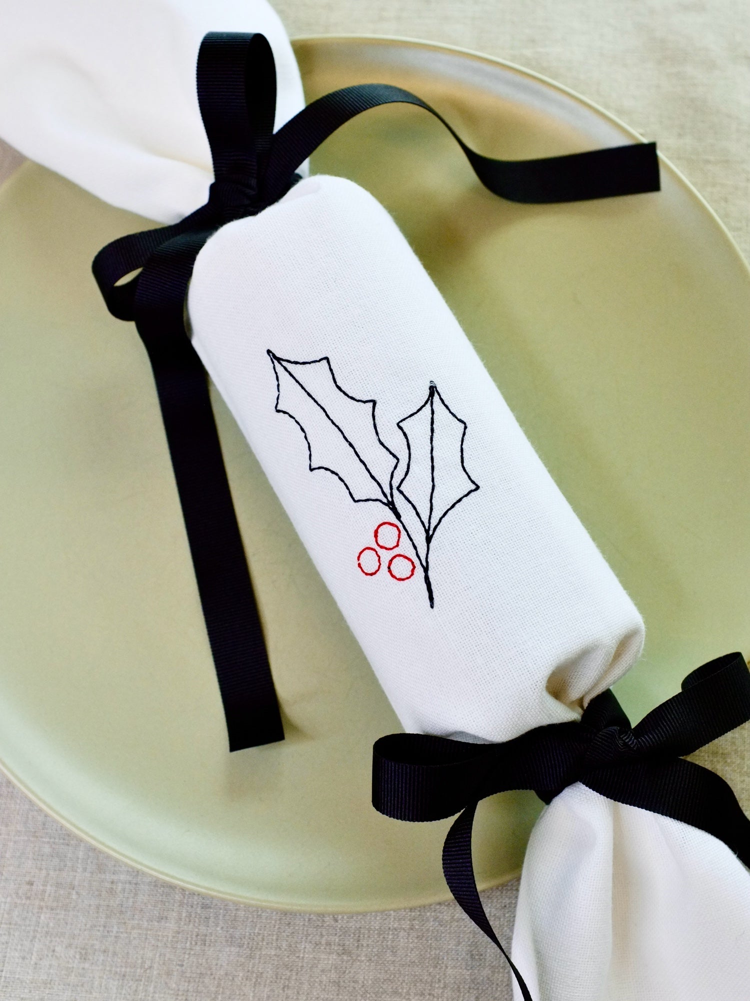 Holly design reusable Christmas embroidered napkin cracker with black bows