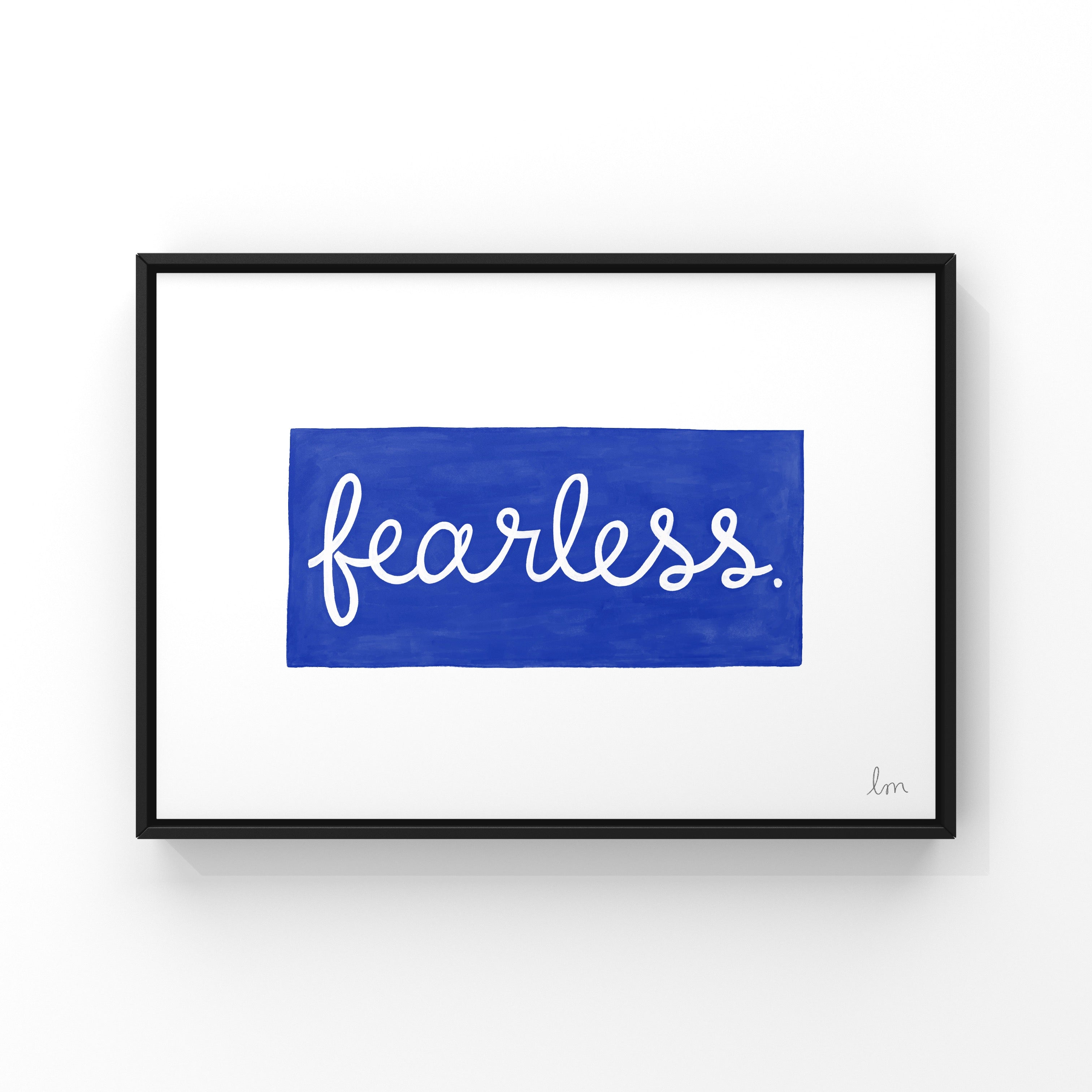 Framed artwork with the word 'fearless' on a blue background