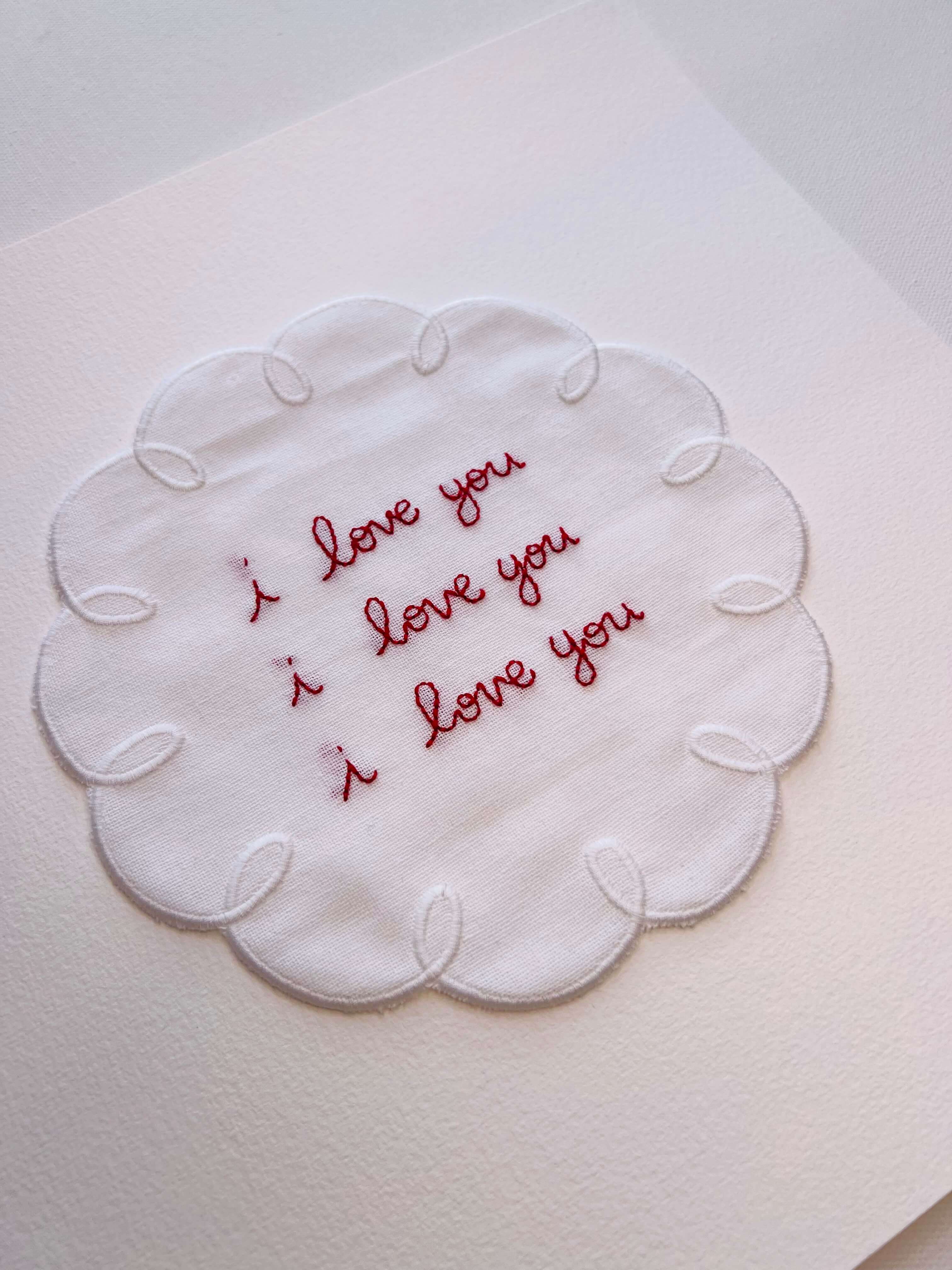 Hand embroidered ‘I love you’ artwork with scallop border