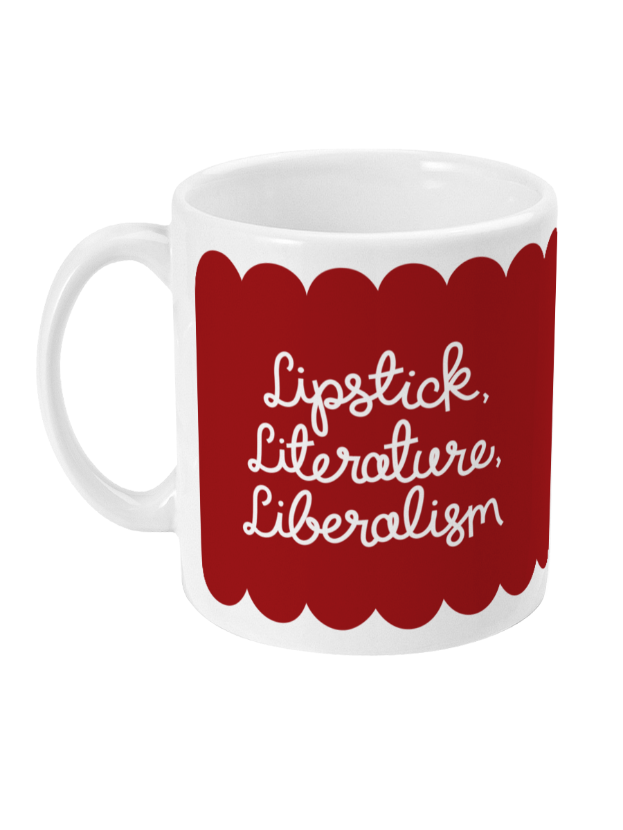Side view of the ‘Lipstick, Literature, Liberalism’ mug, showing the curved handle and hand-lettered text in white against a bold red background.