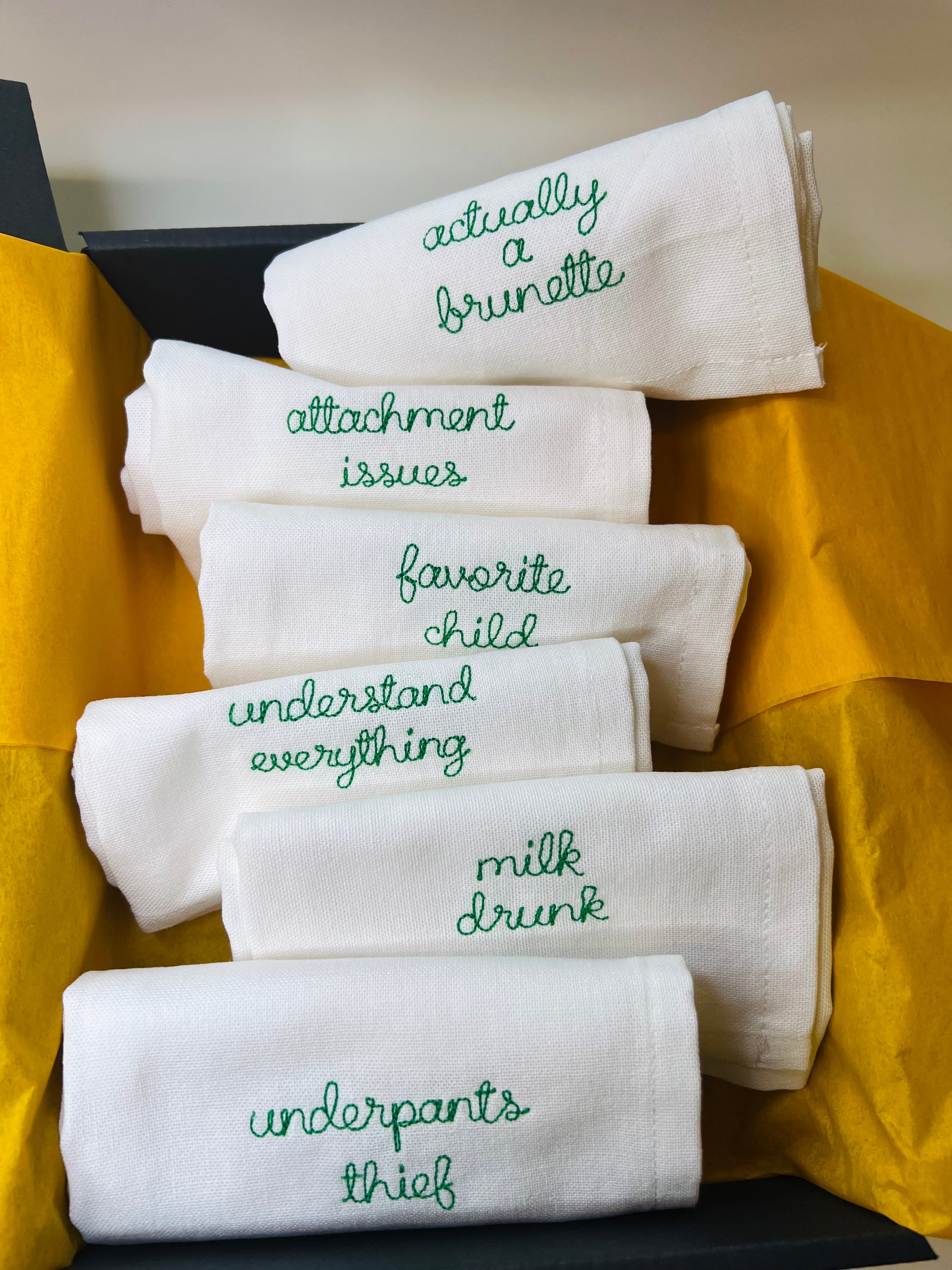 Set of six bespoke embroidered napkins with slogans such as ‘favourite child’ and ‘underpants thief’