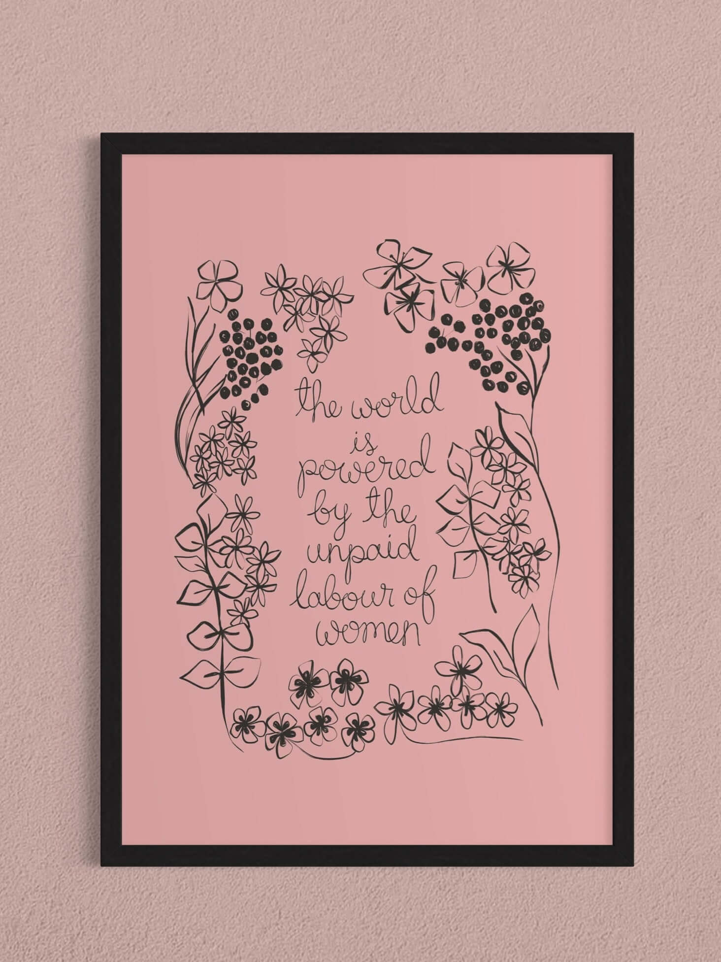 A pink floral art print with the phrase ‘the world is powered by the unpaid labour of women’
