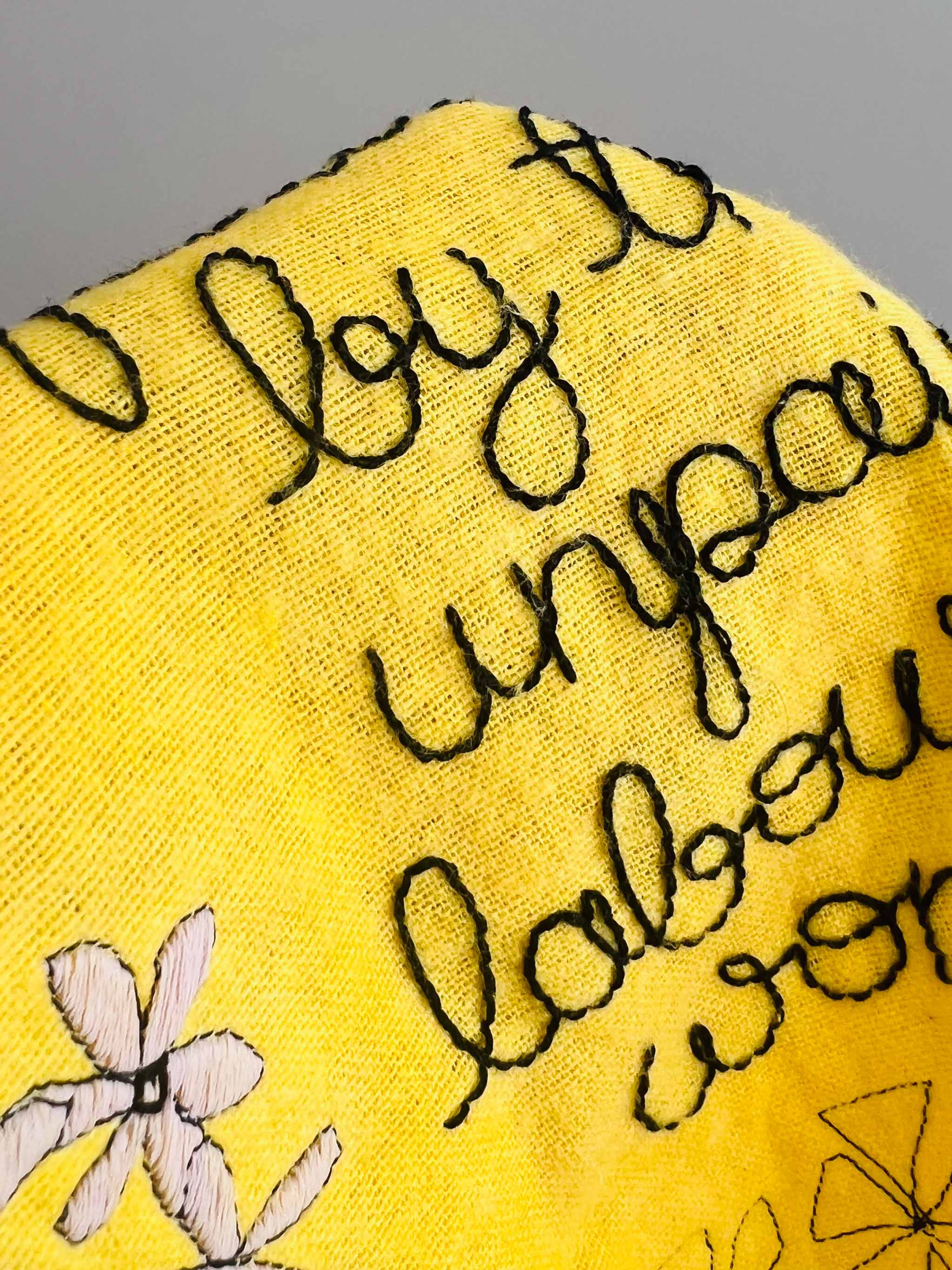 Embroidered yellow domestic duster