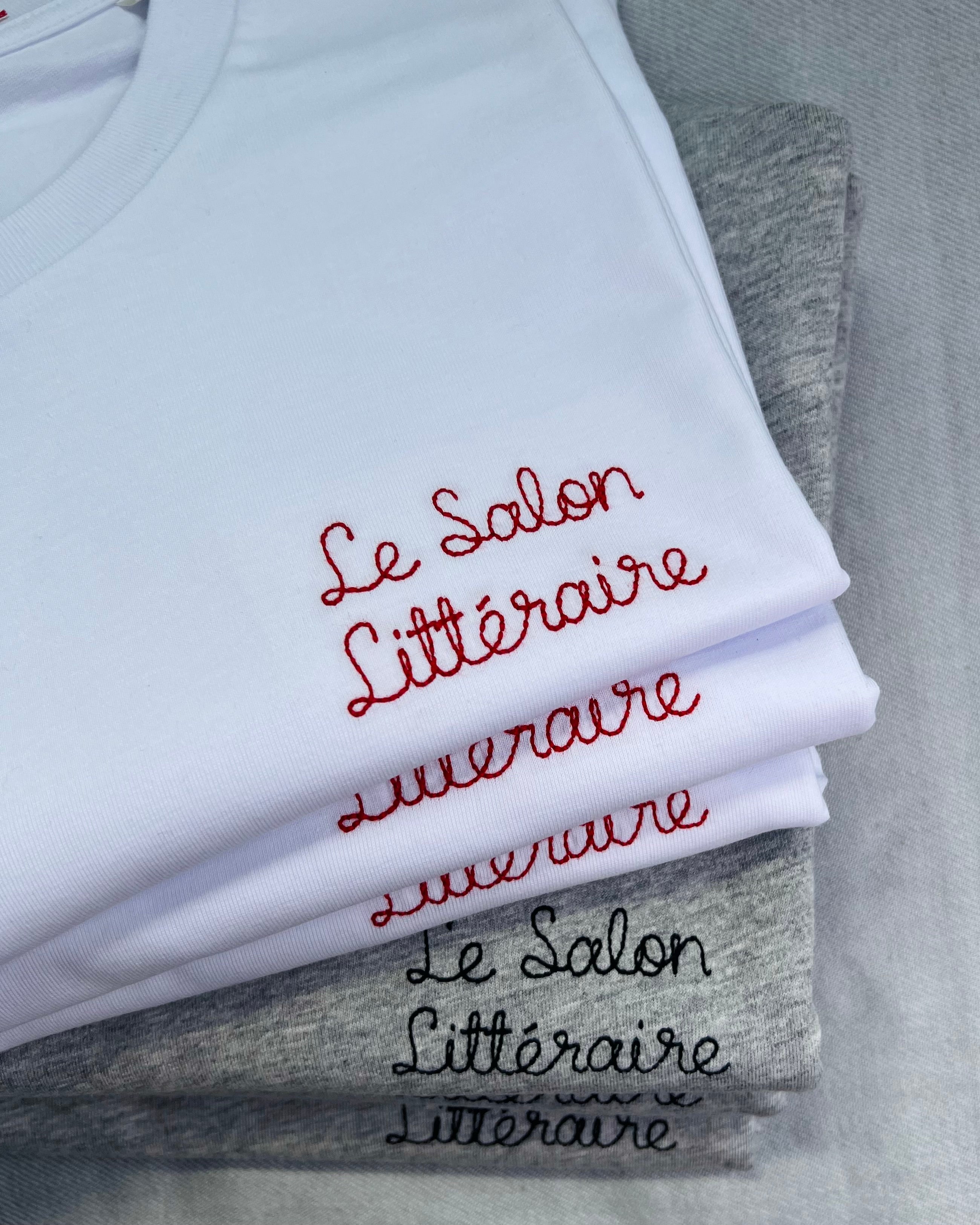 white and grey t-shirts with 'Le Salon Littéraire' embroidered in red and black thread, custom bespoke slogan embroidery