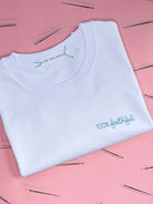 white t-shirt with '100% faithful' embroidered in turquoise thread, custom bespoke slogan embroidery