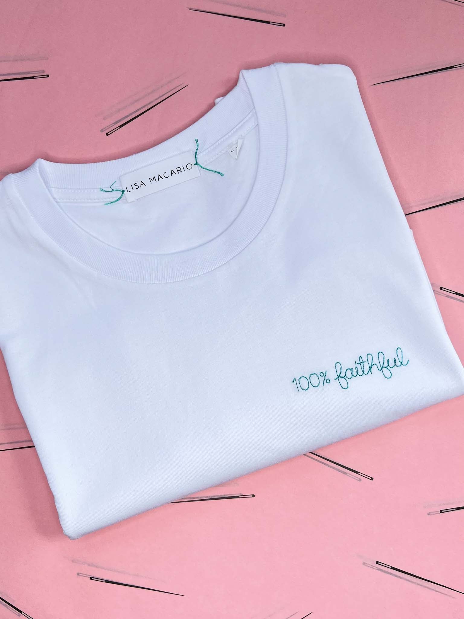 white t-shirt with '100% faithful' embroidered in turquoise thread, custom bespoke slogan embroidery