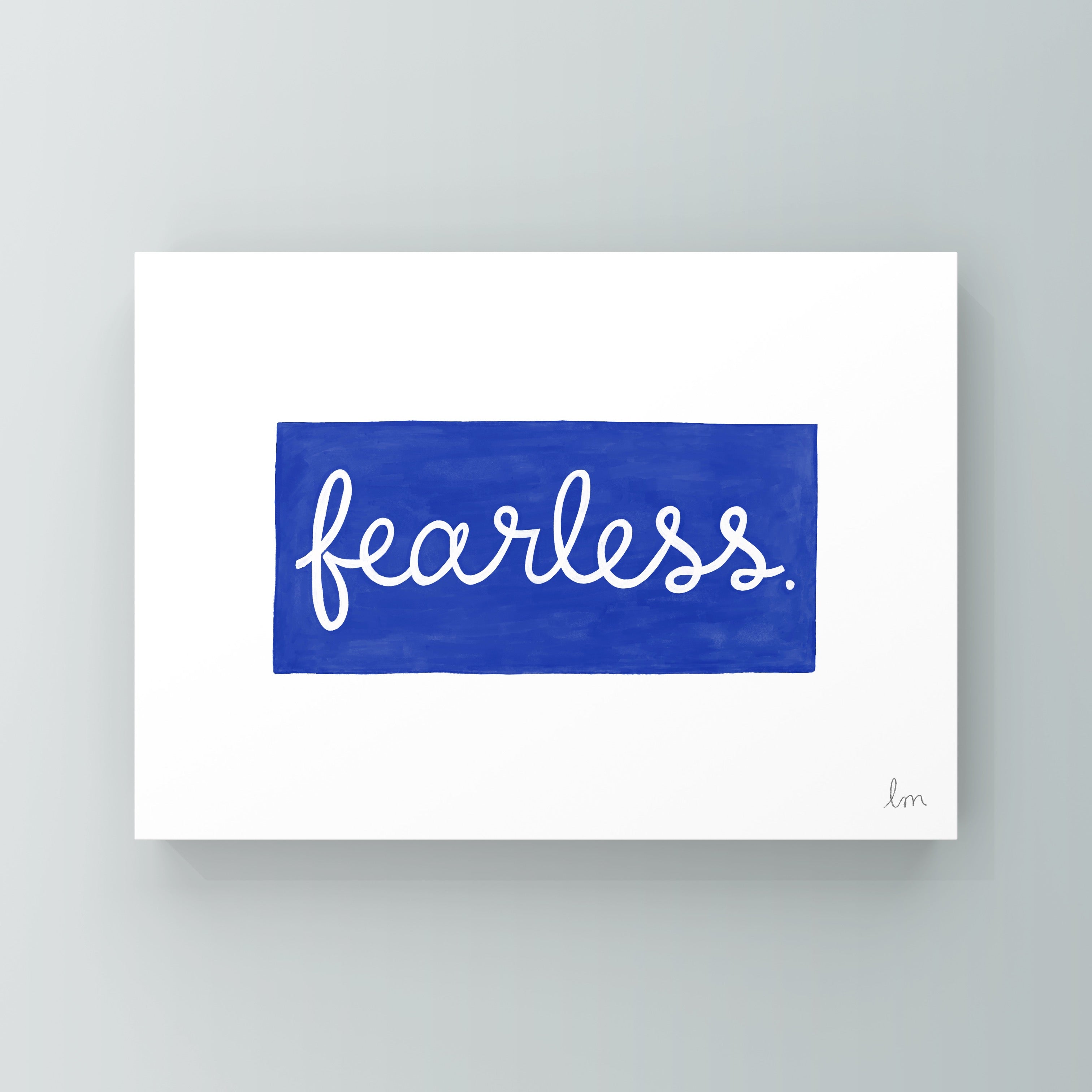 Framed artwork with the word 'fearless' on a blue background