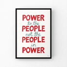 Framed poster with political quote 'Power to the people not the people in power' on a white background