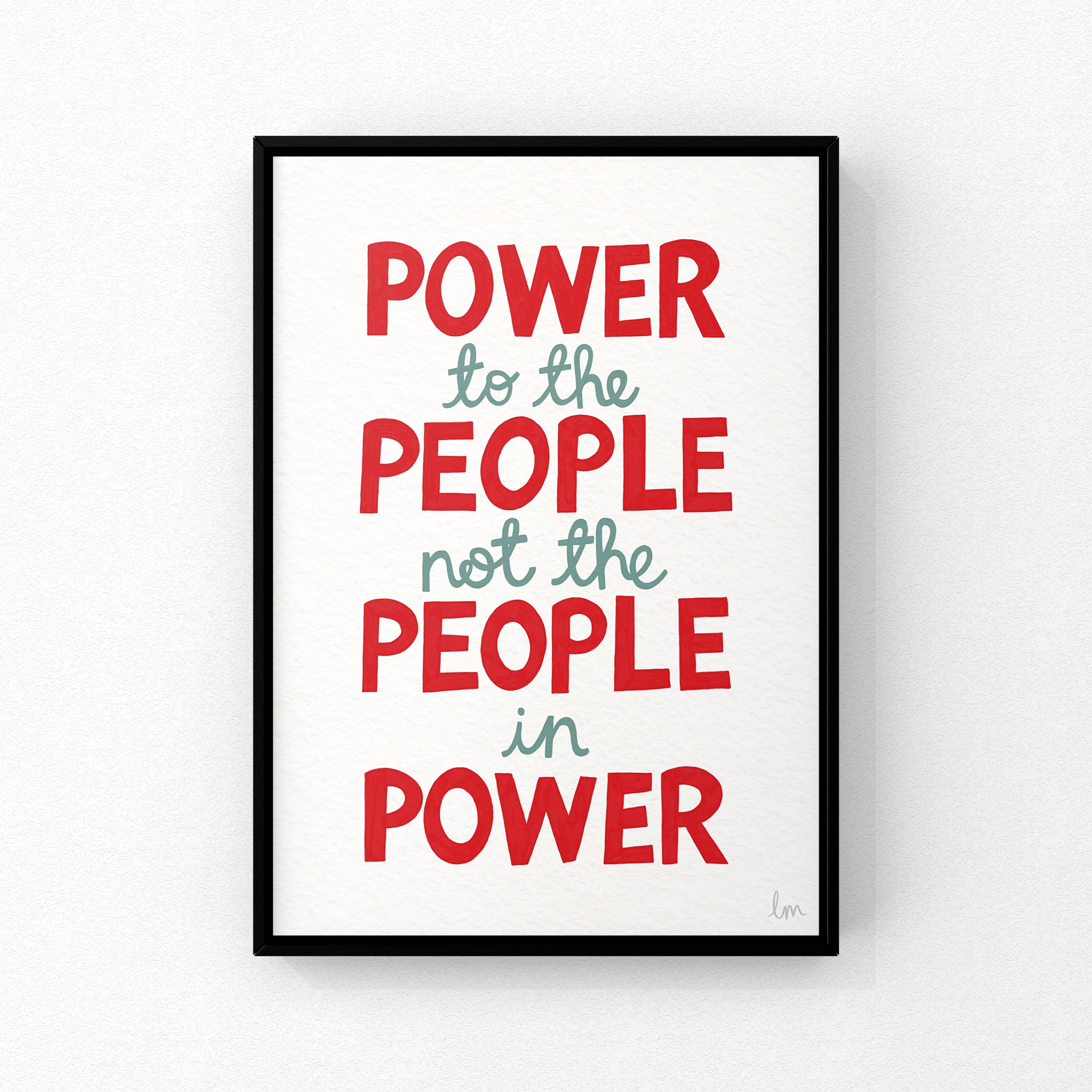 Framed poster with political quote 'Power to the people not the people in power' on a white background
