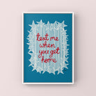 Framed artwork with 'Text me when you get home' on a blue background